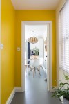 Andrew_Jonathan_Designs_uses_yellow_to_frame_kitchen