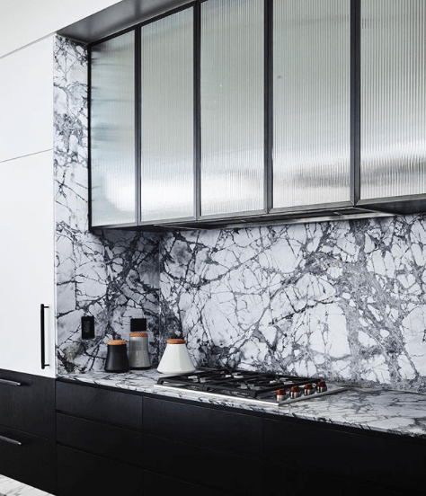 Decus_Interiors_Killcare_Kitchen_with_Reeded_glass_cabinet_doors_and steel